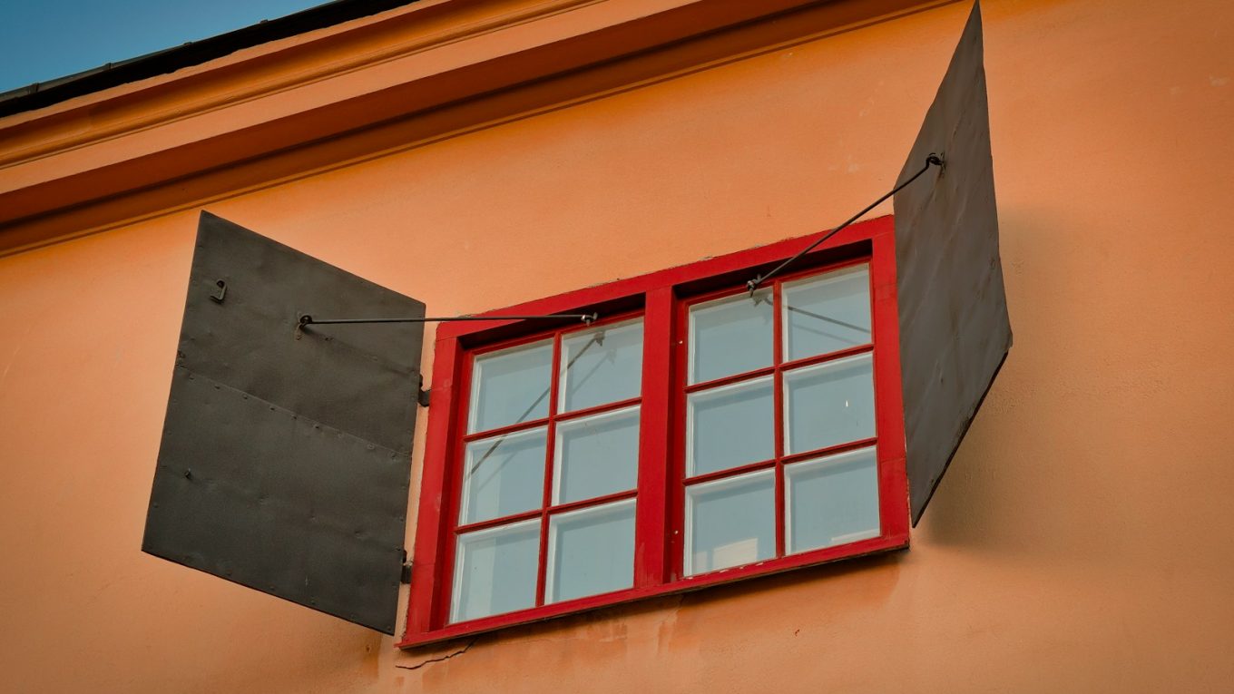 white wooden framed glass window opened